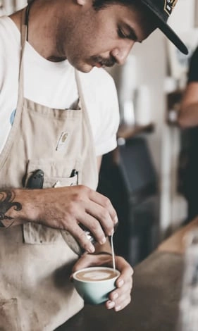 A man making coffee with passion